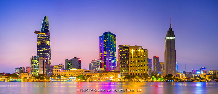 Central Ho Chi Minh City (Saigon) skyline and Saigon River at dusk, Vietnam