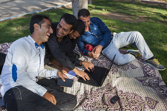 Iran, Central Iran, Neyriz, young Iranian men with laptop computer